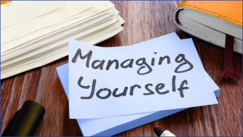Postit note with managing yourself written on it