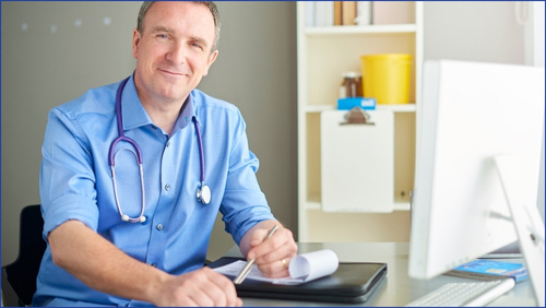 General Practitioner sitting at a desk