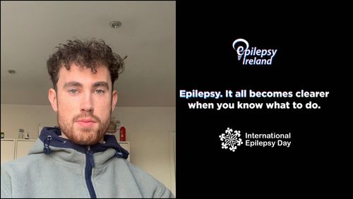 Kevin to the LHS of the picture with EI Logo and message: Epilepsy, it all becomes clearer when you know what to do on a black background with International Epilepsy Day logo at bottom