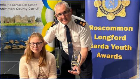 Rebecca being presented her award by a local Garda