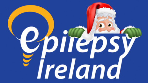 Epilepsy Ireland logo with Santa peeping out over the top of the logo.