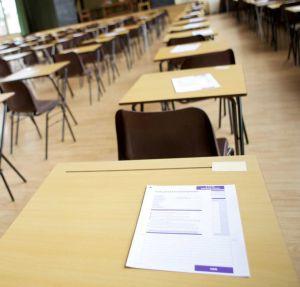 exam hall with desks and chairs.